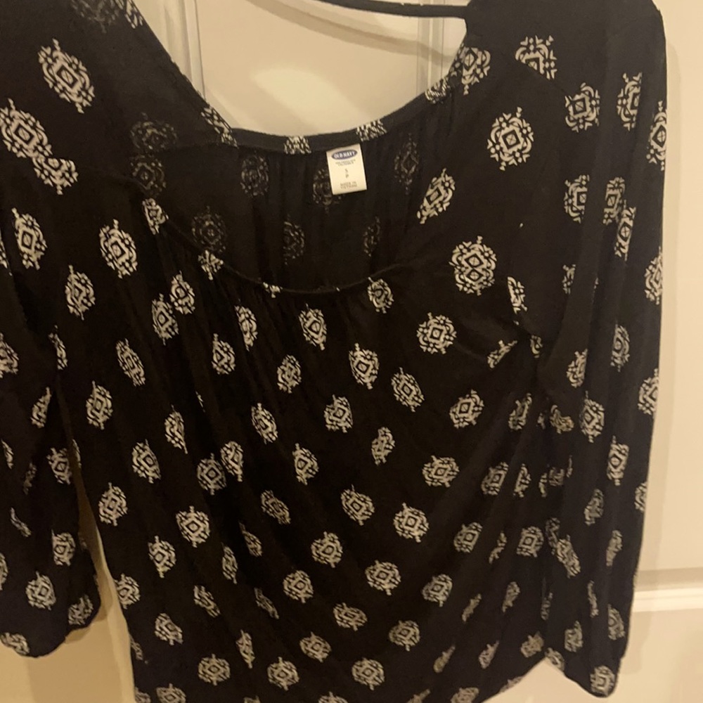 This is a soft long sleeve blouse. 100 percent rayon machine washable